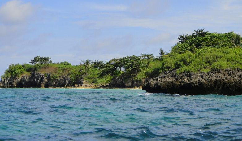 Island hopping at Malapascua Island with beautiful rock formations and crystal clear sea.